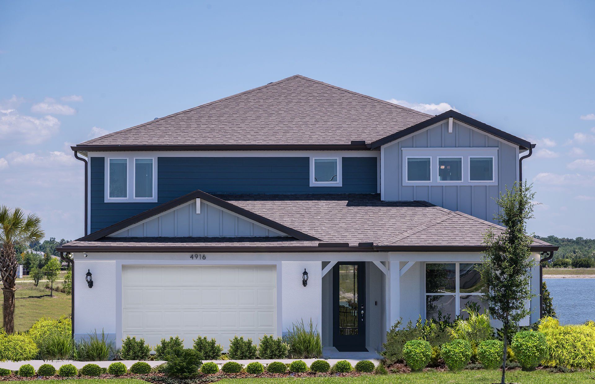 Front exterior of a new home in Riverwood, Zephyrhills, FL, highlighting curb appeal (Image 1). Front exterior of a new home in Riverwood, Zephyrhills, FL, highlighting curb appeal (Image 1).