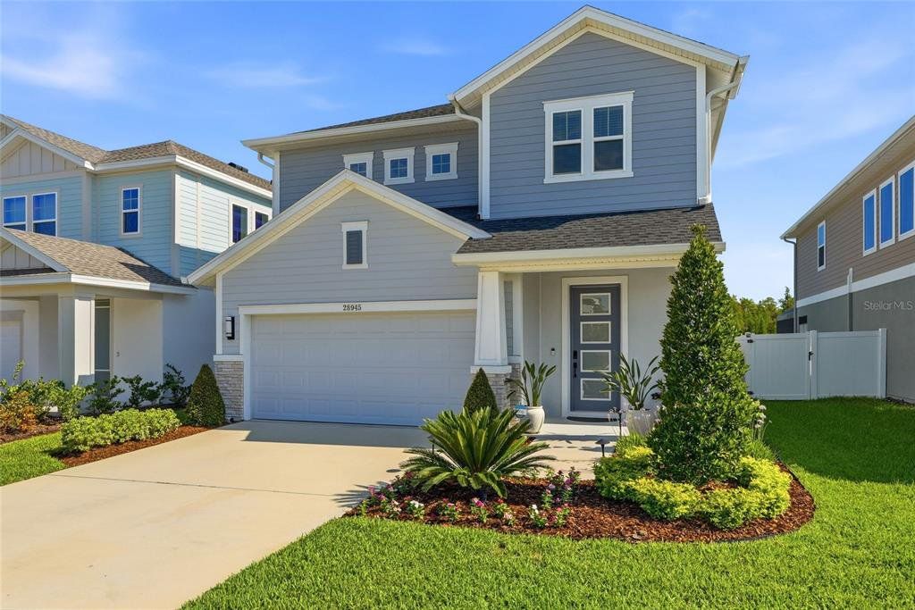 Front exterior of a new home in , Wesley Chapel, FL, highlighting curb appeal (Image 1). Front exterior of a new home in , Wesley Chapel, FL, highlighting curb appeal (Image 1).