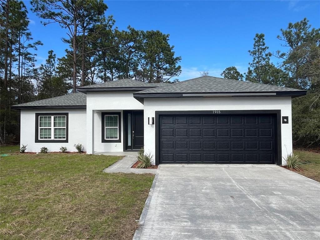 Front exterior of a new home in , Citrus Springs, FL, highlighting curb appeal (Image 1). Front exterior of a new home in , Citrus Springs, FL, highlighting curb appeal (Image 1).