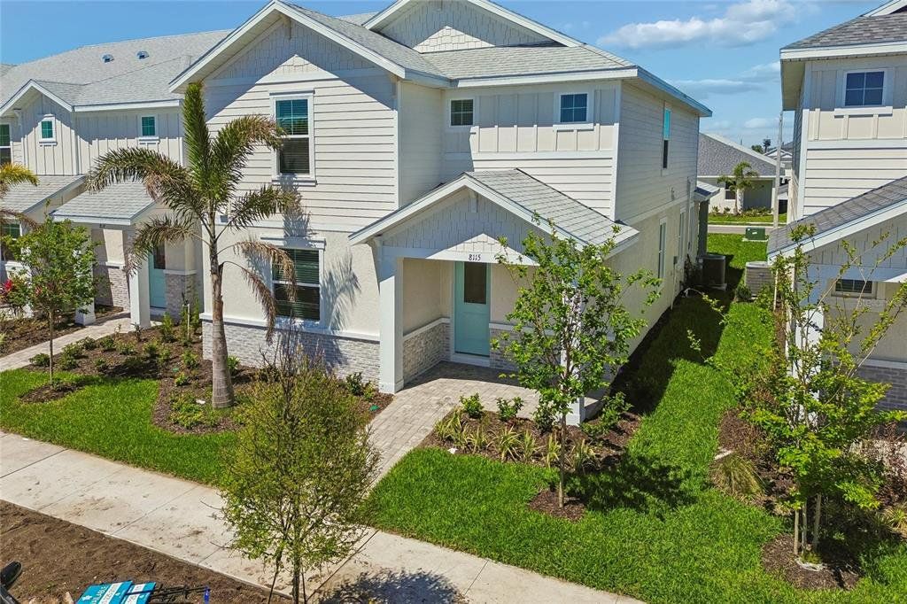 Front exterior of a new home in SeaFlower, Bradenton, FL, highlighting curb appeal (Image 1). Front exterior of a new home in SeaFlower, Bradenton, FL, highlighting curb appeal (Image 1).