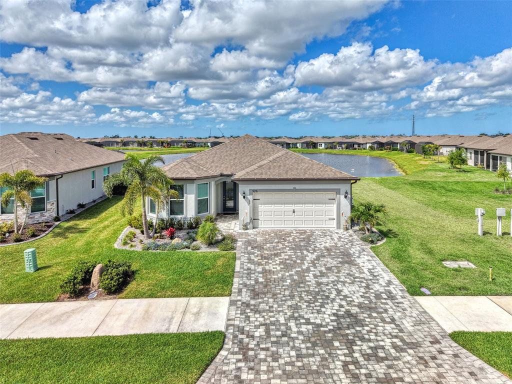 Front exterior of a new home in , Parrish, FL, highlighting curb appeal (Image 1). Front exterior of a new home in , Parrish, FL, highlighting curb appeal (Image 1).