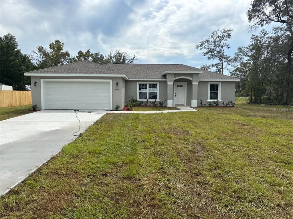 Front exterior of a new home in , Citrus Springs, FL, highlighting curb appeal (Image 1). Front exterior of a new home in , Citrus Springs, FL, highlighting curb appeal (Image 1).