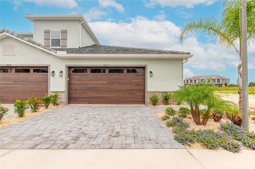 Front exterior of a new home in , New Smyrna Beach, FL, highlighting curb appeal (Image 1). Front exterior of a new home in , New Smyrna Beach, FL, highlighting curb appeal (Image 1).