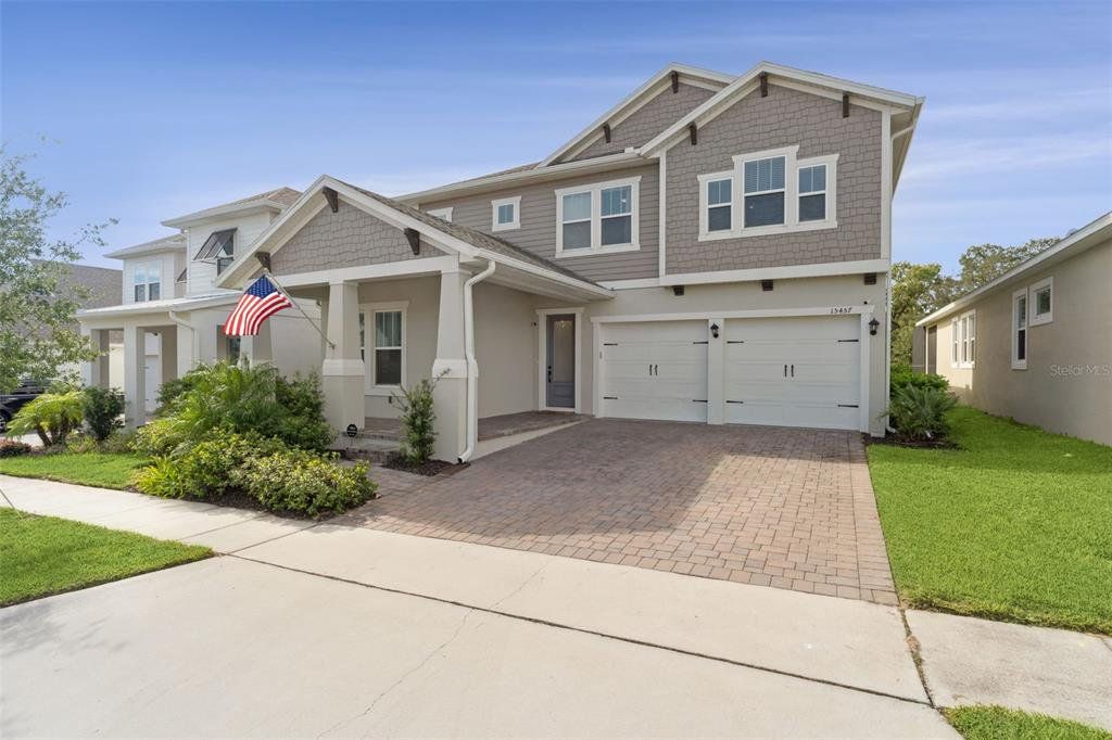 Front exterior of a new home in , Winter Garden, FL, highlighting curb appeal (Image 1). Front exterior of a new home in , Winter Garden, FL, highlighting curb appeal (Image 1).
