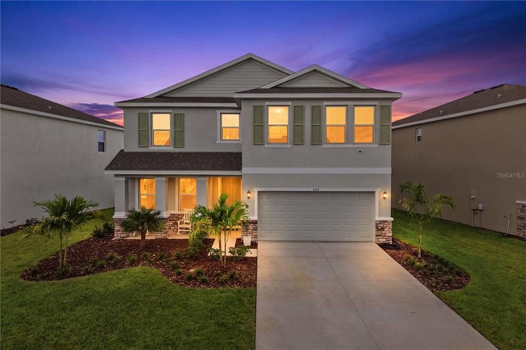 Front exterior of a new home in Solera at Lakewood Ranch, Lakewood Ranch, FL, highlighting curb appeal (Image 1). Front exterior of a new home in Solera at Lakewood Ranch, Lakewood Ranch, FL, highlighting curb appeal (Image 1).