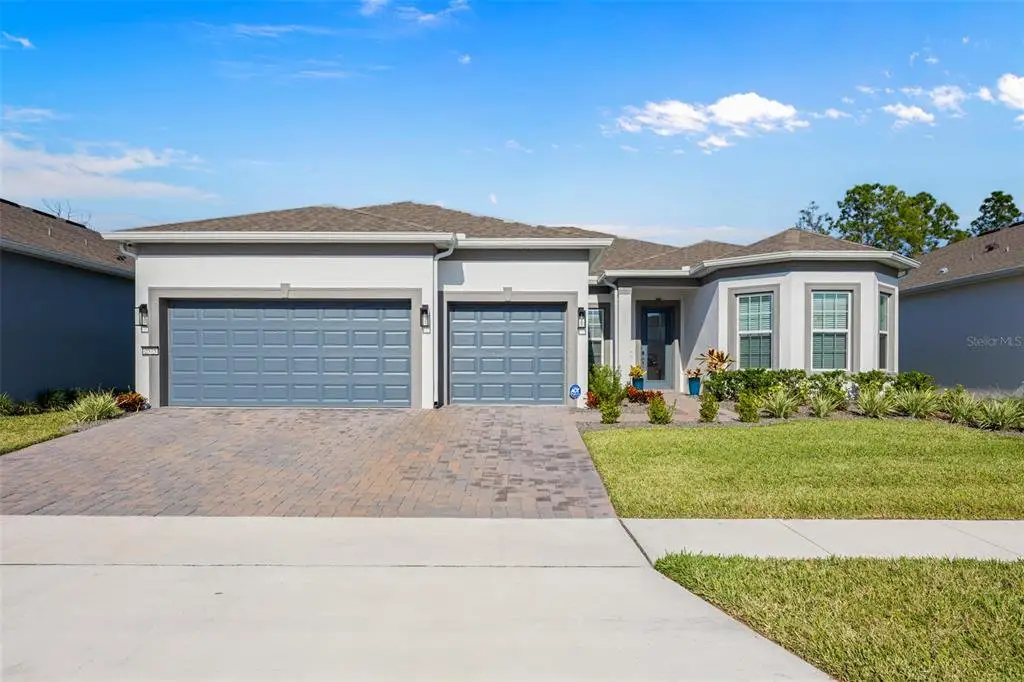 Front exterior of a new home in Del Webb Sunbridge, St. Cloud, FL, highlighting curb appeal (Image 1). Front exterior of a new home in Del Webb Sunbridge, St. Cloud, FL, highlighting curb appeal (Image 1).