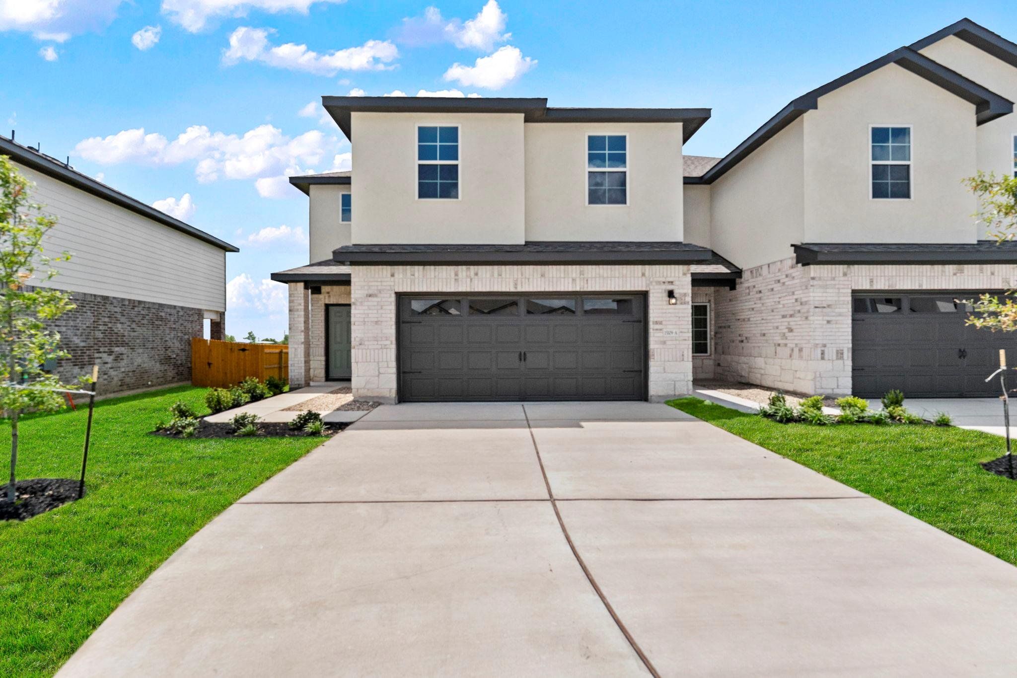 Front exterior of a new home in Palomino, Manor, TX, highlighting curb appeal (Image 1). Front exterior of a new home in Palomino, Manor, TX, highlighting curb appeal (Image 1).