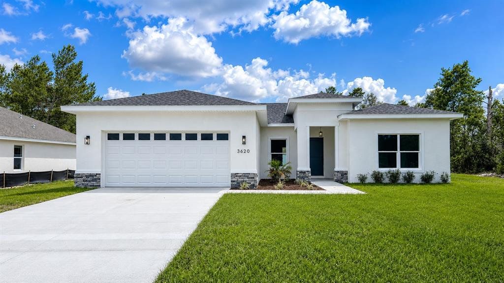 Front exterior of a new home in , Ocala, FL, highlighting curb appeal (Image 1). Front exterior of a new home in , Ocala, FL, highlighting curb appeal (Image 1).