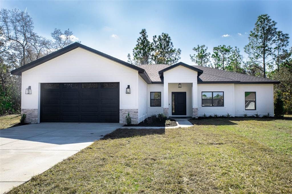 Front exterior of a new home in , Weeki Wachee, FL, highlighting curb appeal (Image 1). Front exterior of a new home in , Weeki Wachee, FL, highlighting curb appeal (Image 1).