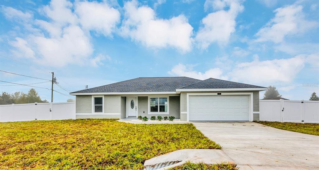 Front exterior of a new home in , Ocala, FL, highlighting curb appeal (Image 1). Front exterior of a new home in , Ocala, FL, highlighting curb appeal (Image 1).
