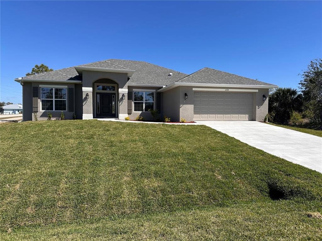 Front exterior of a new home in South Gulf Cove, Port Charlotte, FL, highlighting curb appeal (Image 1). Front exterior of a new home in South Gulf Cove, Port Charlotte, FL, highlighting curb appeal (Image 1).