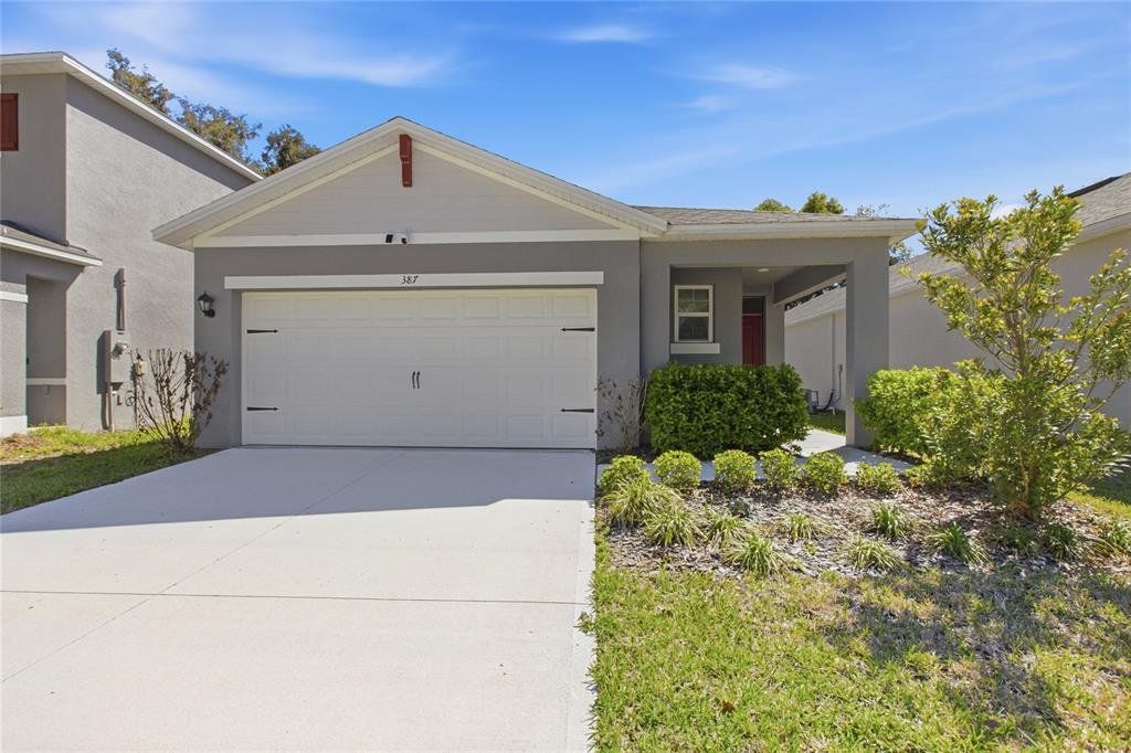Front exterior of a new home in Pelham Park, Deland, FL, highlighting curb appeal (Image 1). Front exterior of a new home in Pelham Park, Deland, FL, highlighting curb appeal (Image 1).