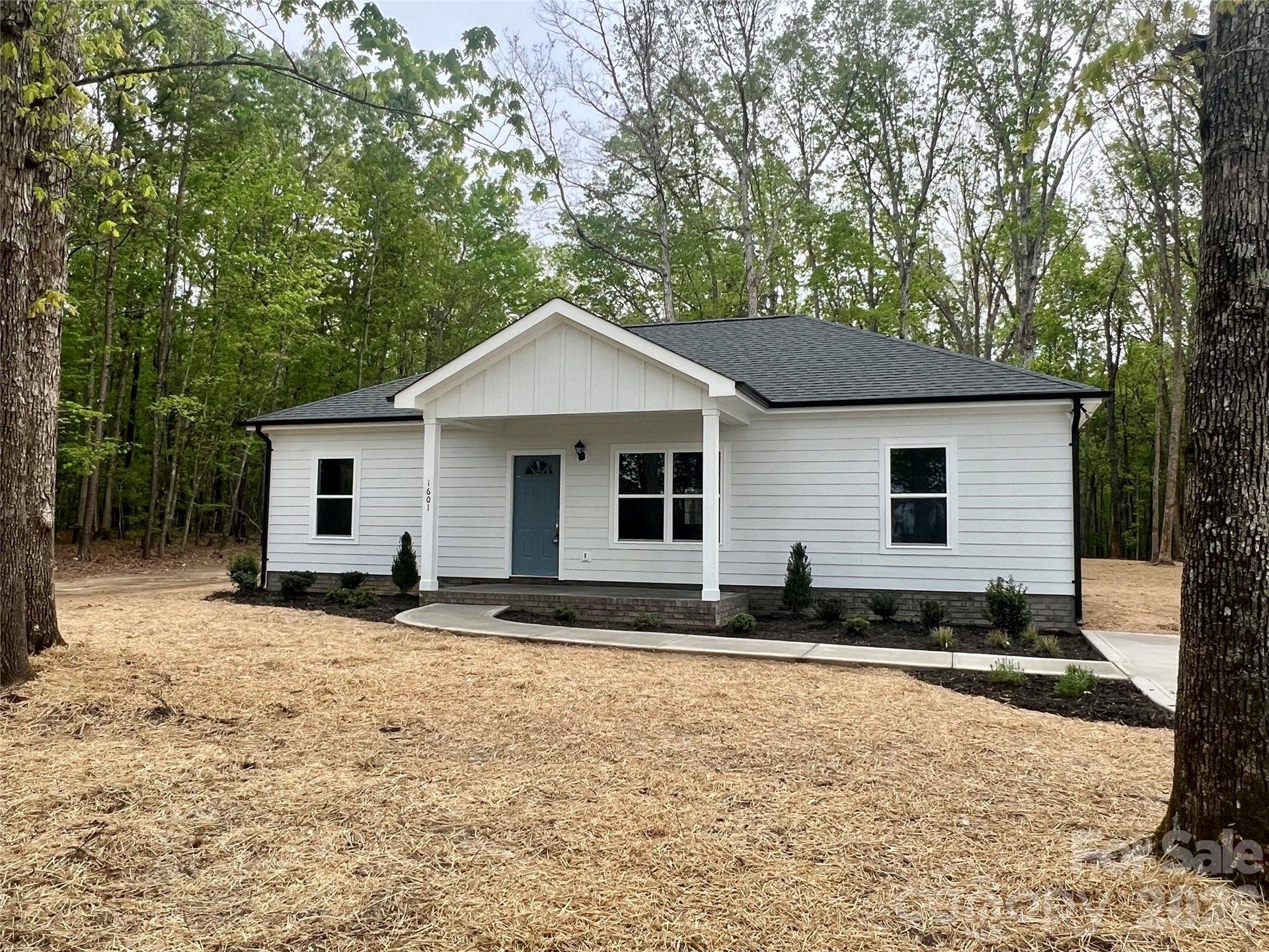 Front exterior of a new home in , Monroe, NC, highlighting curb appeal (Image 1). Front exterior of a new home in , Monroe, NC, highlighting curb appeal (Image 1).