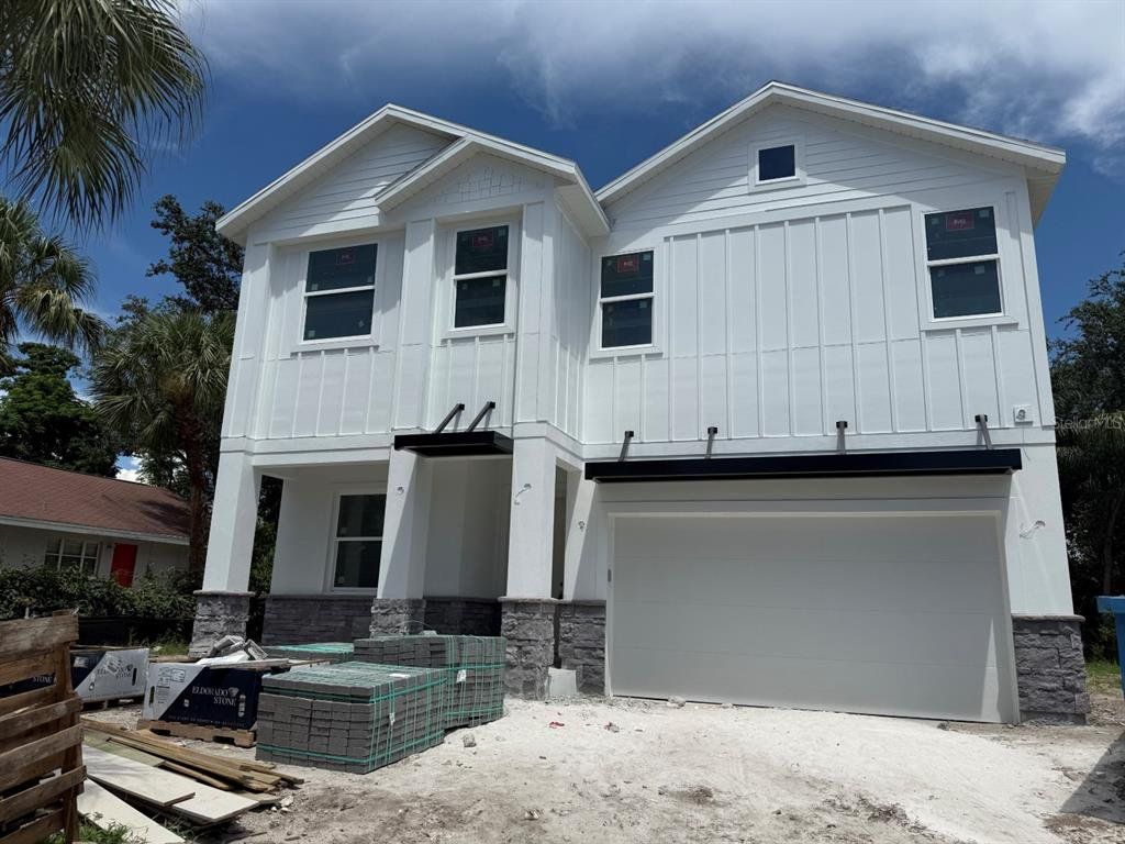 Front exterior of a new home in , Tampa, FL, highlighting curb appeal (Image 1).