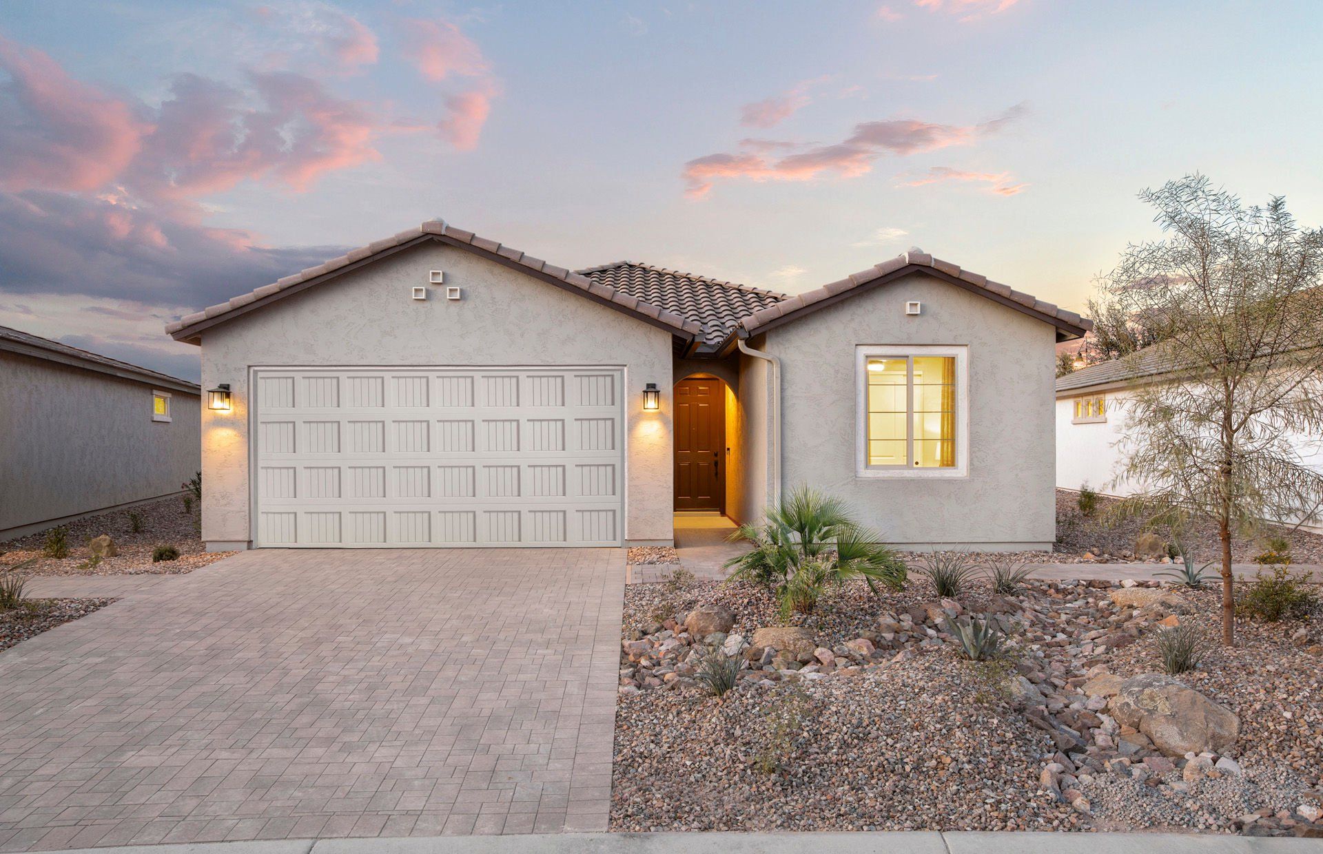 Front exterior of a new home in Sun City Anthem at Merrill Ranch, Florence, AZ, highlighting curb appeal (Image 1). Front exterior of a new home in Sun City Anthem at Merrill Ranch, Florence, AZ, highlighting curb appeal (Image 1).