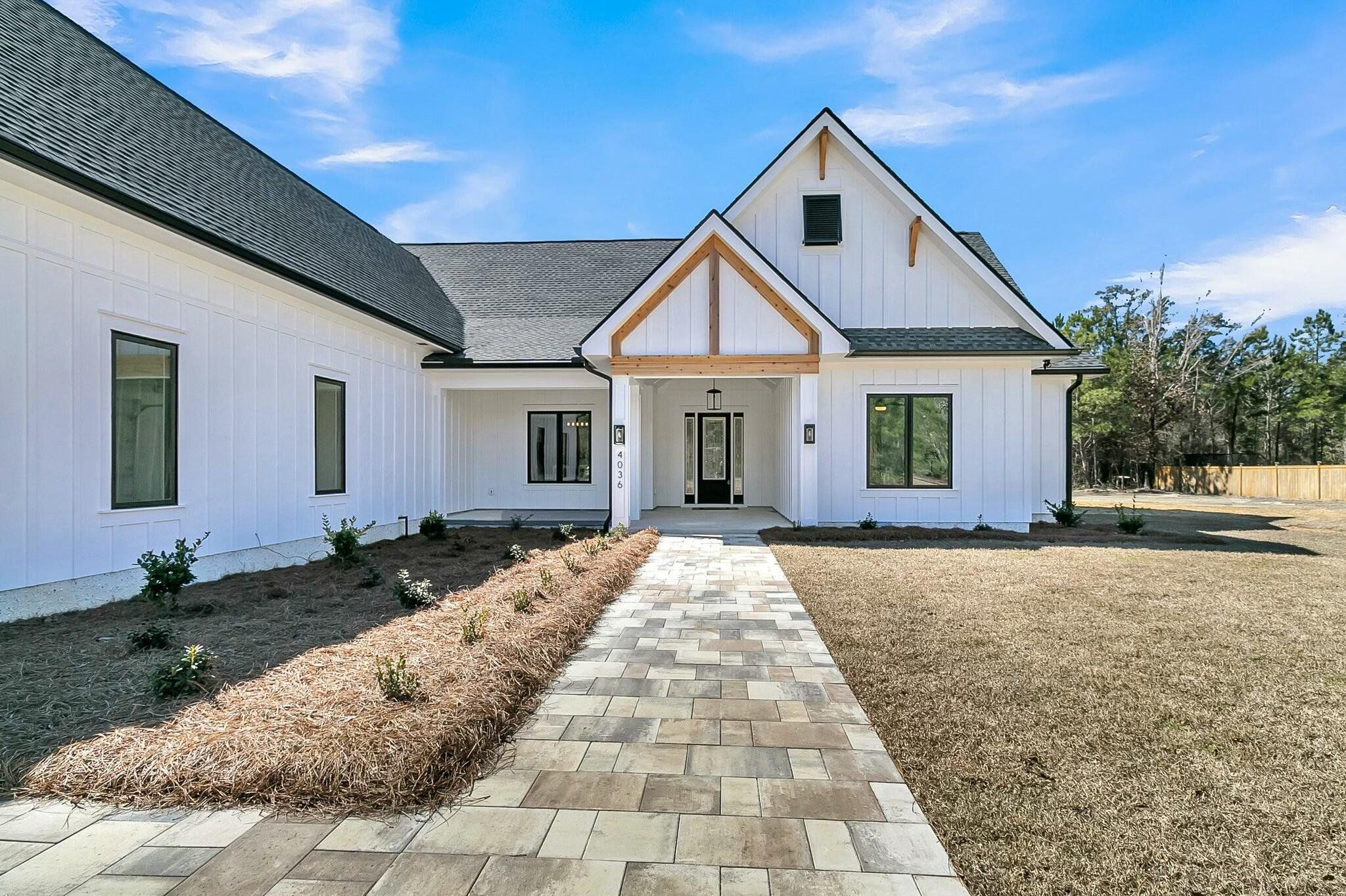 Front exterior of a new home in , McClellanville, SC, highlighting curb appeal (Image 1). Front exterior of a new home in , McClellanville, SC, highlighting curb appeal (Image 1).