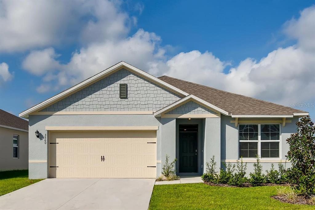 Front exterior of a new home in Buena Lago, St. Cloud, FL, highlighting curb appeal (Image 1). Front exterior of a new home in Buena Lago, St. Cloud, FL, highlighting curb appeal (Image 1).