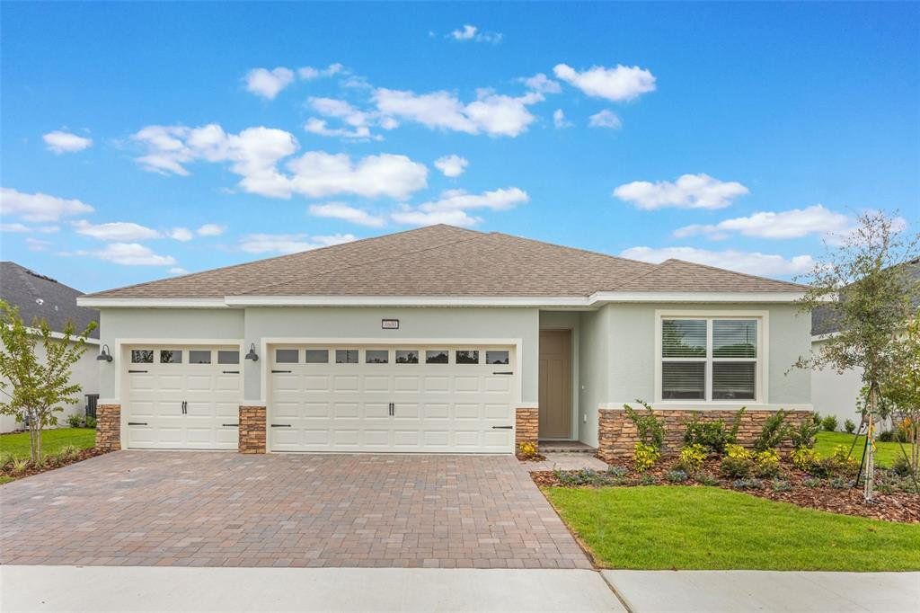 Front exterior of a new home in Lakes of Mount Dora, Mount Dora, FL, highlighting curb appeal (Image 1). Front exterior of a new home in Lakes of Mount Dora, Mount Dora, FL, highlighting curb appeal (Image 1).