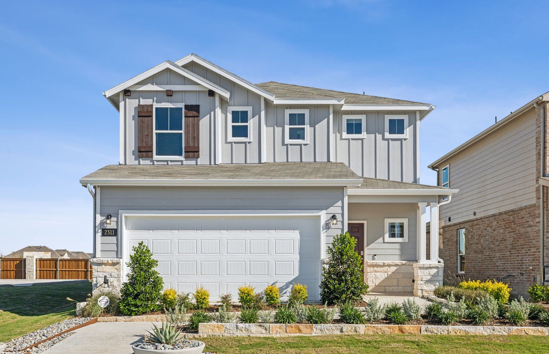Front exterior of a new home in Ashford Crossing, Lowry Crossing, TX, highlighting curb appeal (Image 1). Front exterior of a new home in Ashford Crossing, Lowry Crossing, TX, highlighting curb appeal (Image 1).