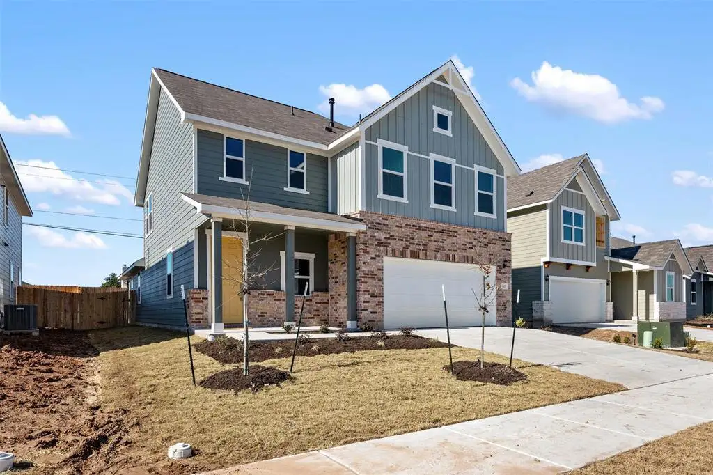 Board and batten siding pairs with brick accents to create classic exterior appeal. Board and batten siding pairs with brick accents to create classic exterior appeal.