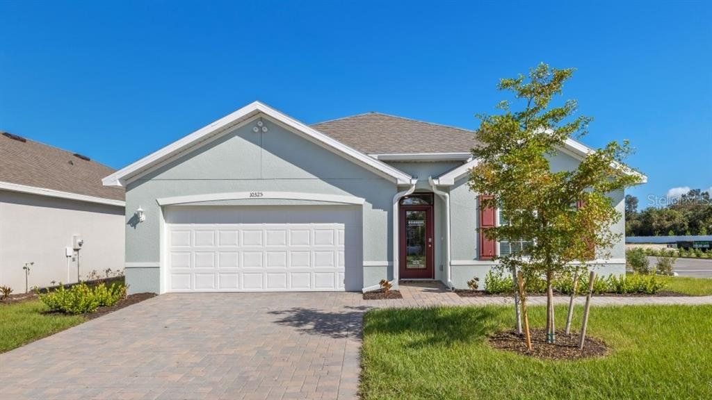 Front exterior of a new home in , Port Charlotte, FL, highlighting curb appeal (Image 1). Front exterior of a new home in , Port Charlotte, FL, highlighting curb appeal (Image 1).