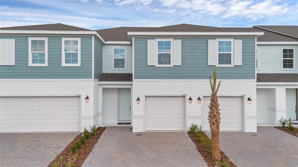 Front exterior of a new home in Delaney Reserve, Deland, FL, highlighting curb appeal (Image 1). Front exterior of a new home in Delaney Reserve, Deland, FL, highlighting curb appeal (Image 1).