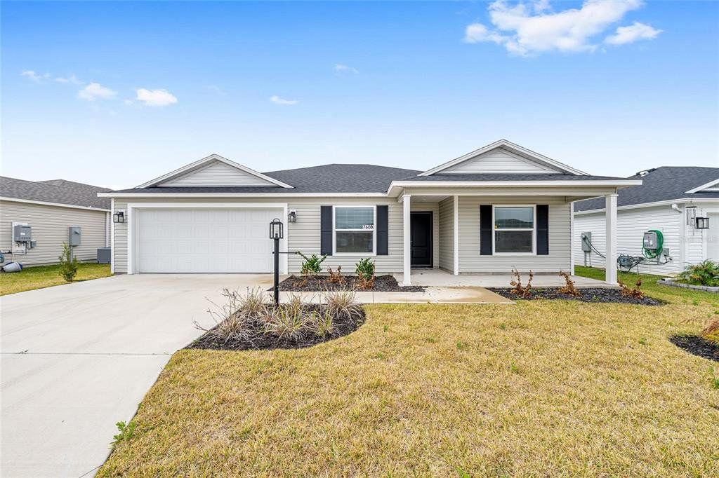 Front exterior of a new home in , The Villages, FL, highlighting curb appeal (Image 1). Front exterior of a new home in , The Villages, FL, highlighting curb appeal (Image 1).