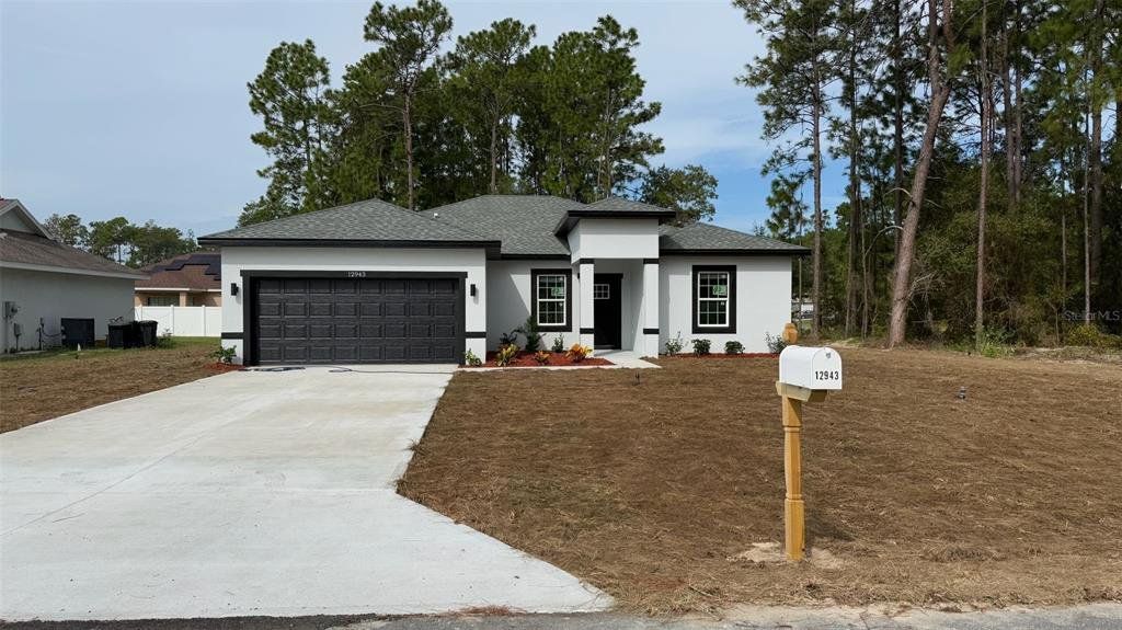 Front exterior of a new home in , Ocala, FL, highlighting curb appeal (Image 1). Front exterior of a new home in , Ocala, FL, highlighting curb appeal (Image 1).
