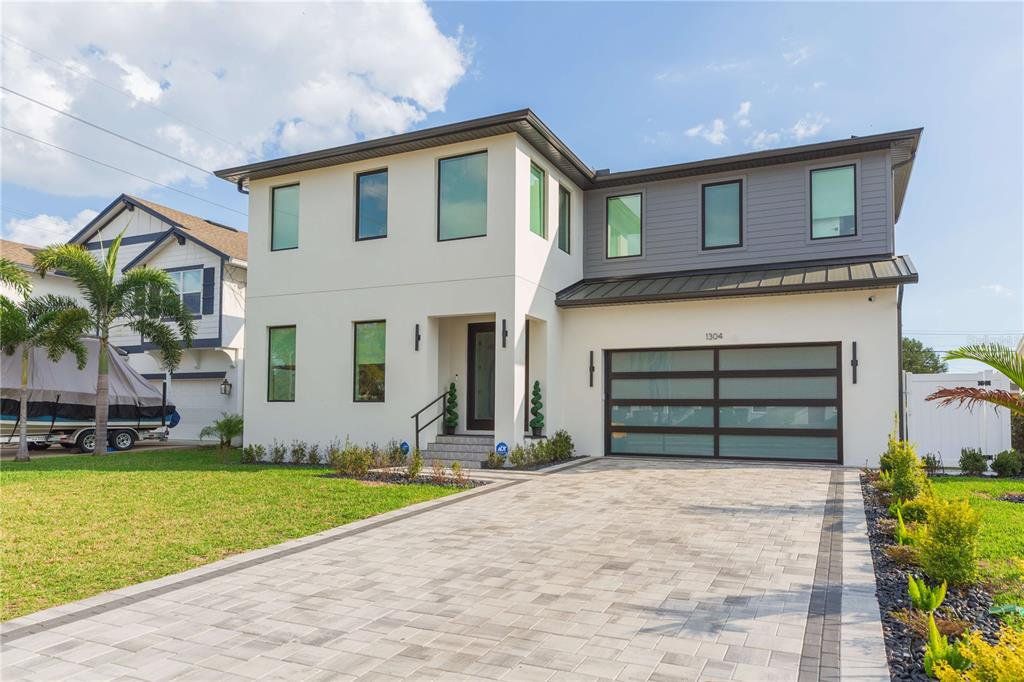 Front exterior of a new home in , Tampa, FL, highlighting curb appeal (Image 1). Front exterior of a new home in , Tampa, FL, highlighting curb appeal (Image 1).