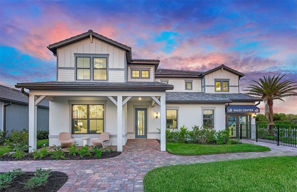 Front exterior of a new home in Reagan Landing, Bradenton, FL, highlighting curb appeal (Image 1). Front exterior of a new home in Reagan Landing, Bradenton, FL, highlighting curb appeal (Image 1).