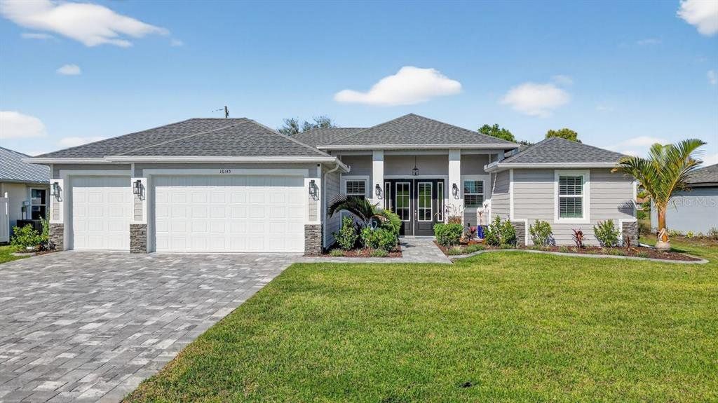 Front exterior of a new home in , Punta Gorda, FL, highlighting curb appeal (Image 1). Front exterior of a new home in , Punta Gorda, FL, highlighting curb appeal (Image 1).