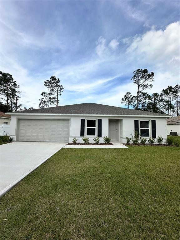Front exterior of a new home in Palm Coast: Value Collection, Palm Coast, FL, highlighting curb appeal (Image 1).