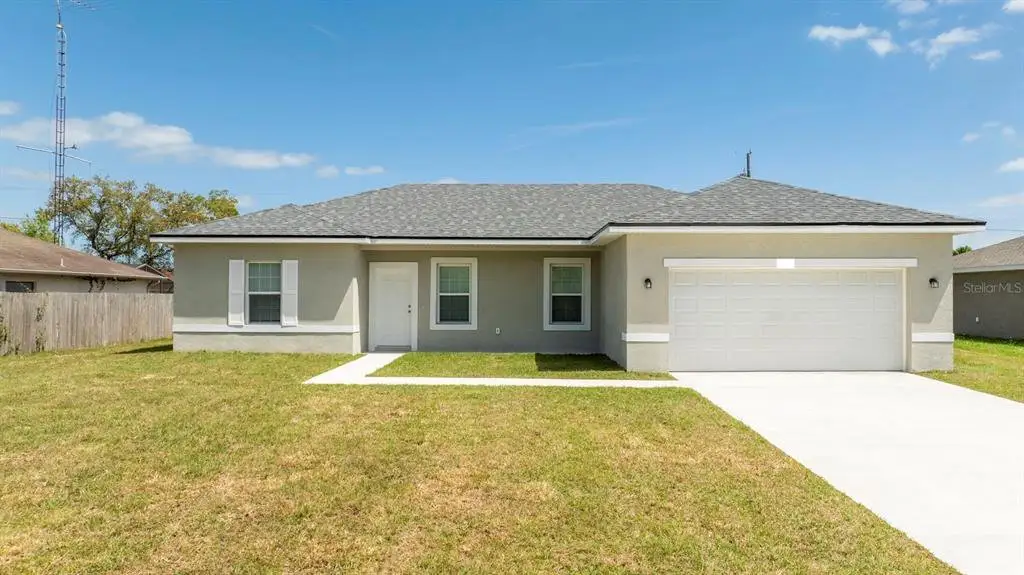 Front exterior of a new home in , Ocala, FL, highlighting curb appeal (Image 1). Front exterior of a new home in , Ocala, FL, highlighting curb appeal (Image 1).
