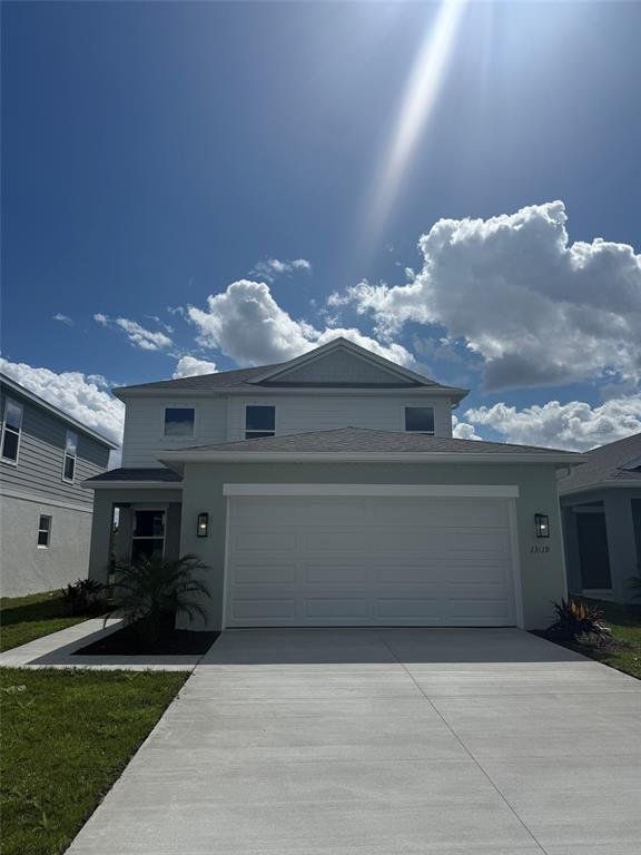 Front exterior of a new home in Broadleaf, Parrish, FL, highlighting curb appeal (Image 1). Front exterior of a new home in Broadleaf, Parrish, FL, highlighting curb appeal (Image 1).