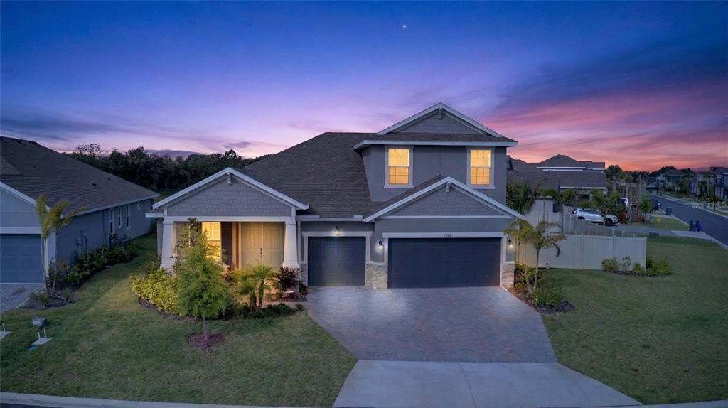 Front exterior of a new home in Seaire, Parrish, FL, highlighting curb appeal (Image 1). Front exterior of a new home in Seaire, Parrish, FL, highlighting curb appeal (Image 1).