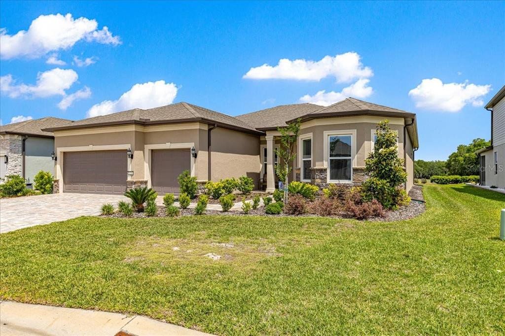 Front exterior of a new home in , Ocala, FL, highlighting curb appeal (Image 1). Front exterior of a new home in , Ocala, FL, highlighting curb appeal (Image 1).