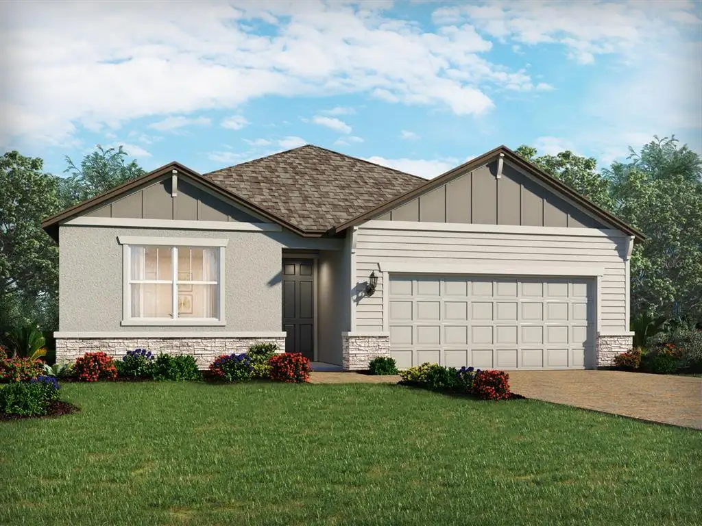 Front exterior of a new home in Legends Preserve - Signature Series, Daytona Beach, FL, highlighting curb appeal (Image 1). Front exterior of a new home in Legends Preserve - Signature Series, Daytona Beach, FL, highlighting curb appeal (Image 1).