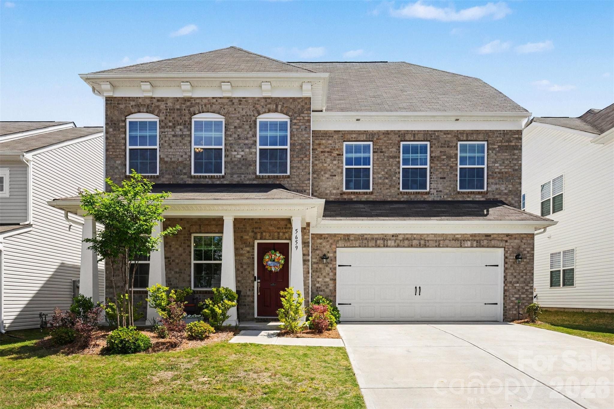 Front exterior of a new home in Walnut Creek, Lancaster, SC, highlighting curb appeal (Image 1). Front exterior of a new home in Walnut Creek, Lancaster, SC, highlighting curb appeal (Image 1).
