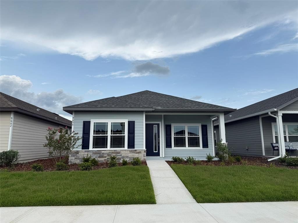 Front exterior of a new home in Lugano, Gainesville, FL, highlighting curb appeal (Image 1). Front exterior of a new home in Lugano, Gainesville, FL, highlighting curb appeal (Image 1).