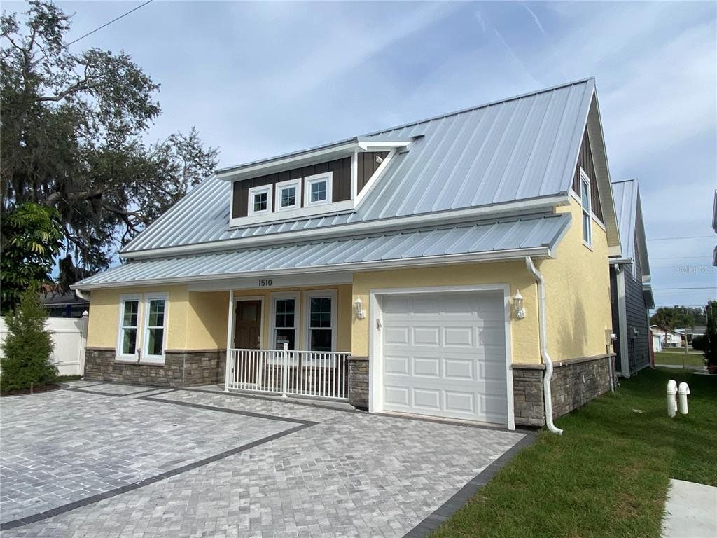 Front exterior of a new home in , Sarasota, FL, highlighting curb appeal (Image 1). Front exterior of a new home in , Sarasota, FL, highlighting curb appeal (Image 1).