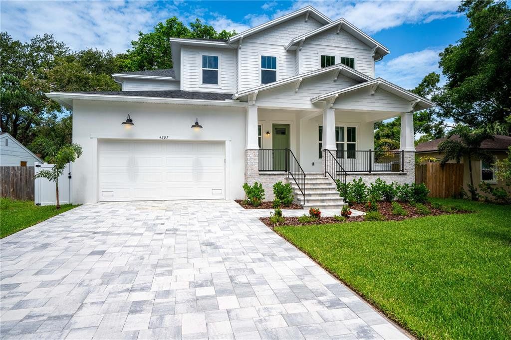 Front exterior of a new home in , Tampa, FL, highlighting curb appeal (Image 1). Front exterior of a new home in , Tampa, FL, highlighting curb appeal (Image 1).