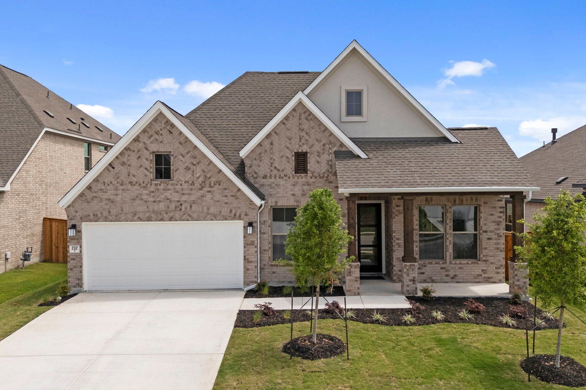 Front exterior of a new home in 6 Creeks, Kyle, TX, highlighting curb appeal (Image 1). Front exterior of a new home in 6 Creeks, Kyle, TX, highlighting curb appeal (Image 1).