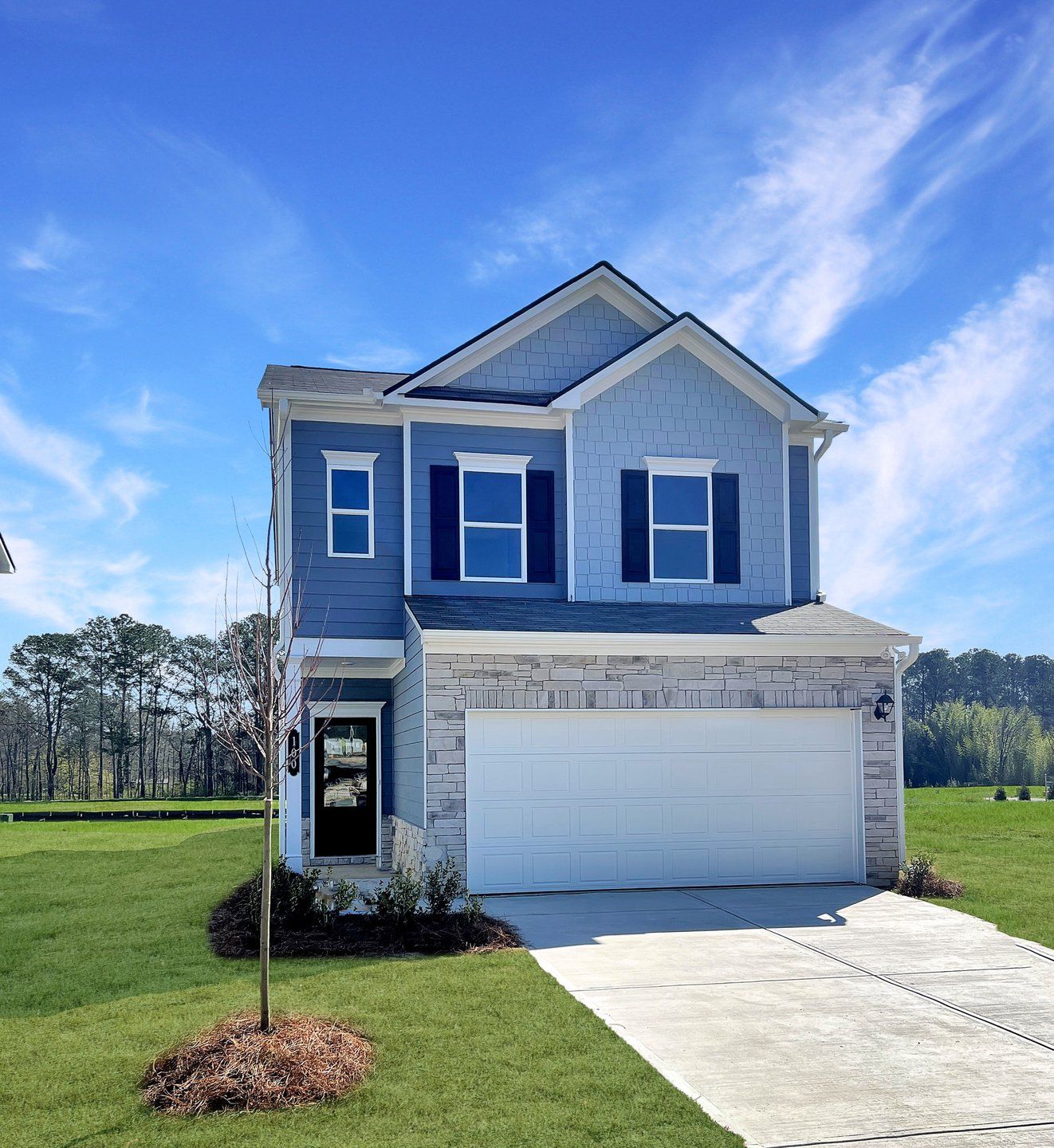 Front exterior of a new home in The Andros, Dalton, GA, highlighting curb appeal (Image 1). Front exterior of a new home in The Andros, Dalton, GA, highlighting curb appeal (Image 1).