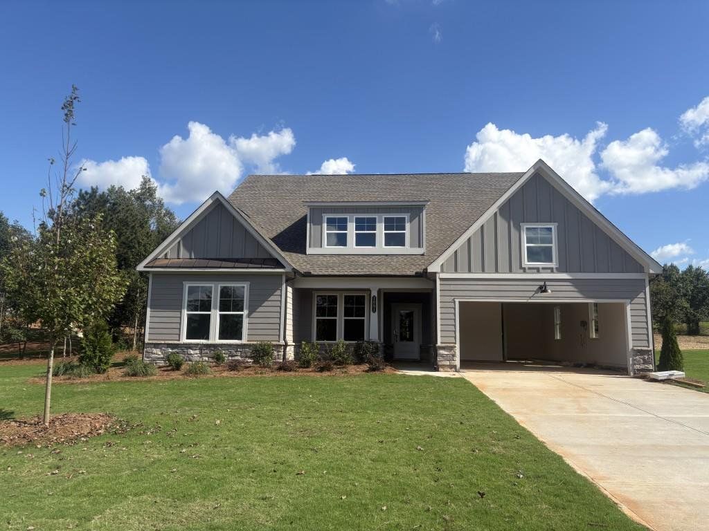 Front exterior of a new home in Wellington Estates, Madison, GA, highlighting curb appeal (Image 1).