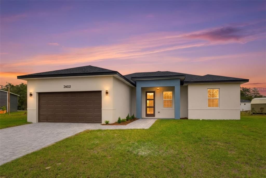 Front exterior of a new home in , Ocala, FL, highlighting curb appeal (Image 1). Front exterior of a new home in , Ocala, FL, highlighting curb appeal (Image 1).