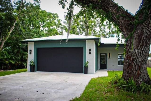 Front exterior of a new home in , Okeechobee, FL, highlighting curb appeal (Image 1). Front exterior of a new home in , Okeechobee, FL, highlighting curb appeal (Image 1).