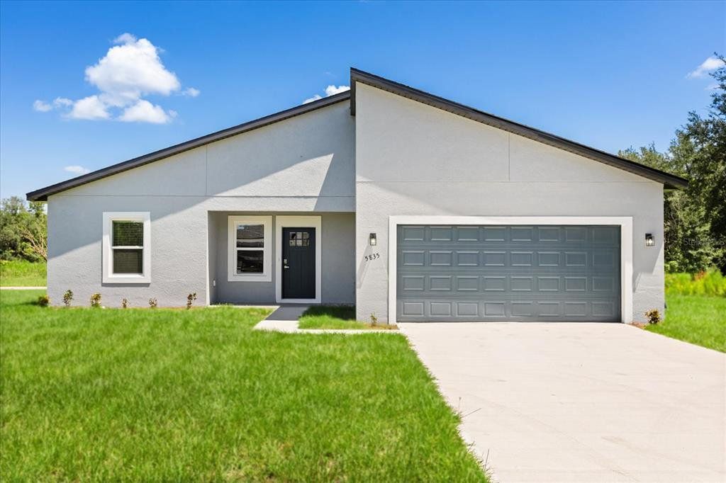 Front exterior of a new home in , Ocala, FL, highlighting curb appeal (Image 1). Front exterior of a new home in , Ocala, FL, highlighting curb appeal (Image 1).
