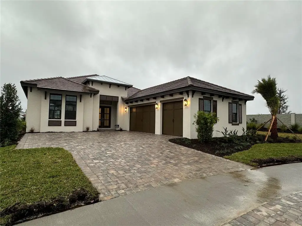 Front exterior of a new home in , Wesley Chapel, FL, highlighting curb appeal (Image 1). Front exterior of a new home in , Wesley Chapel, FL, highlighting curb appeal (Image 1).