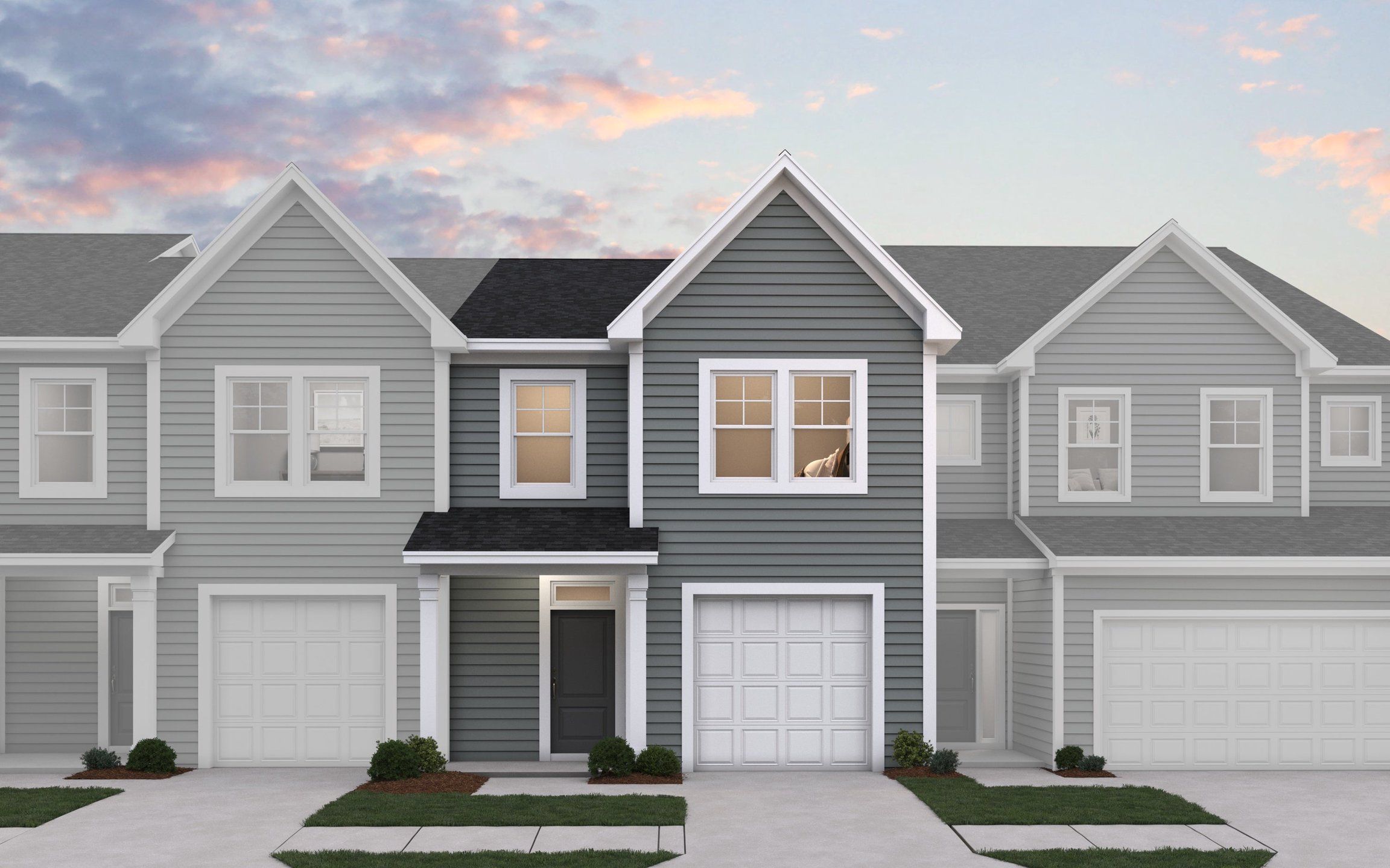 Front exterior of a new home in The Towns at North Lakes, Fuquay Varina, NC, highlighting curb appeal (Image 1). Front exterior of a new home in The Towns at North Lakes, Fuquay Varina, NC, highlighting curb appeal (Image 1).