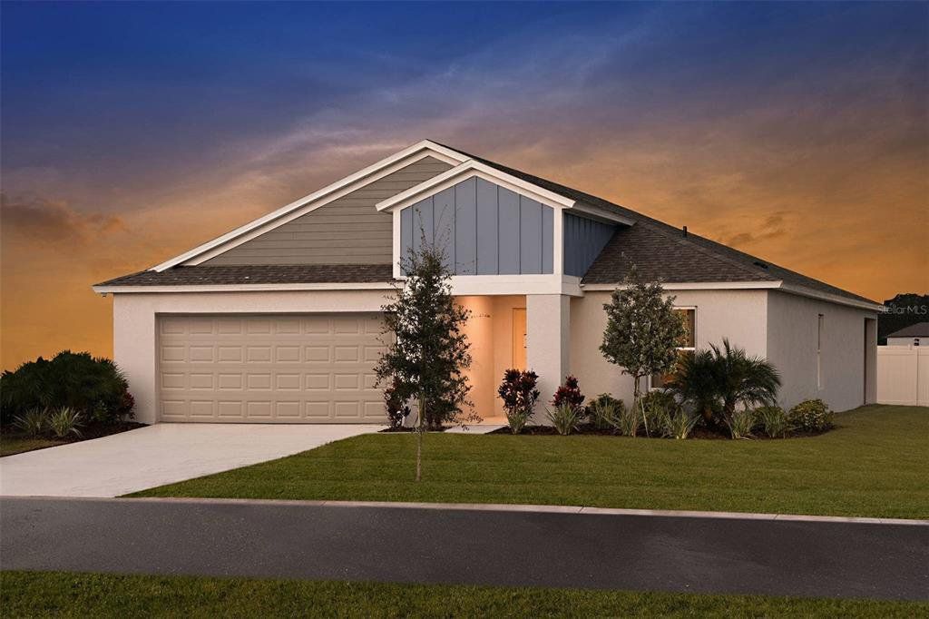 Front exterior of a new home in Villa Mar, Winter Haven, FL, highlighting curb appeal (Image 1). Front exterior of a new home in Villa Mar, Winter Haven, FL, highlighting curb appeal (Image 1).